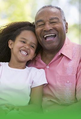 grandfather and his granddaughter smiling